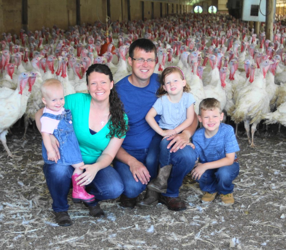 Katie and Nick Hermanson with their children Lucille, 2; Charlotte, 5; Gavin, 7. The Hermansons are fifth generation farmers who live in Story City. Photo credit: Iowa State Fair